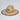 Straw hat with a green patch featuring a fish design on a light gray background