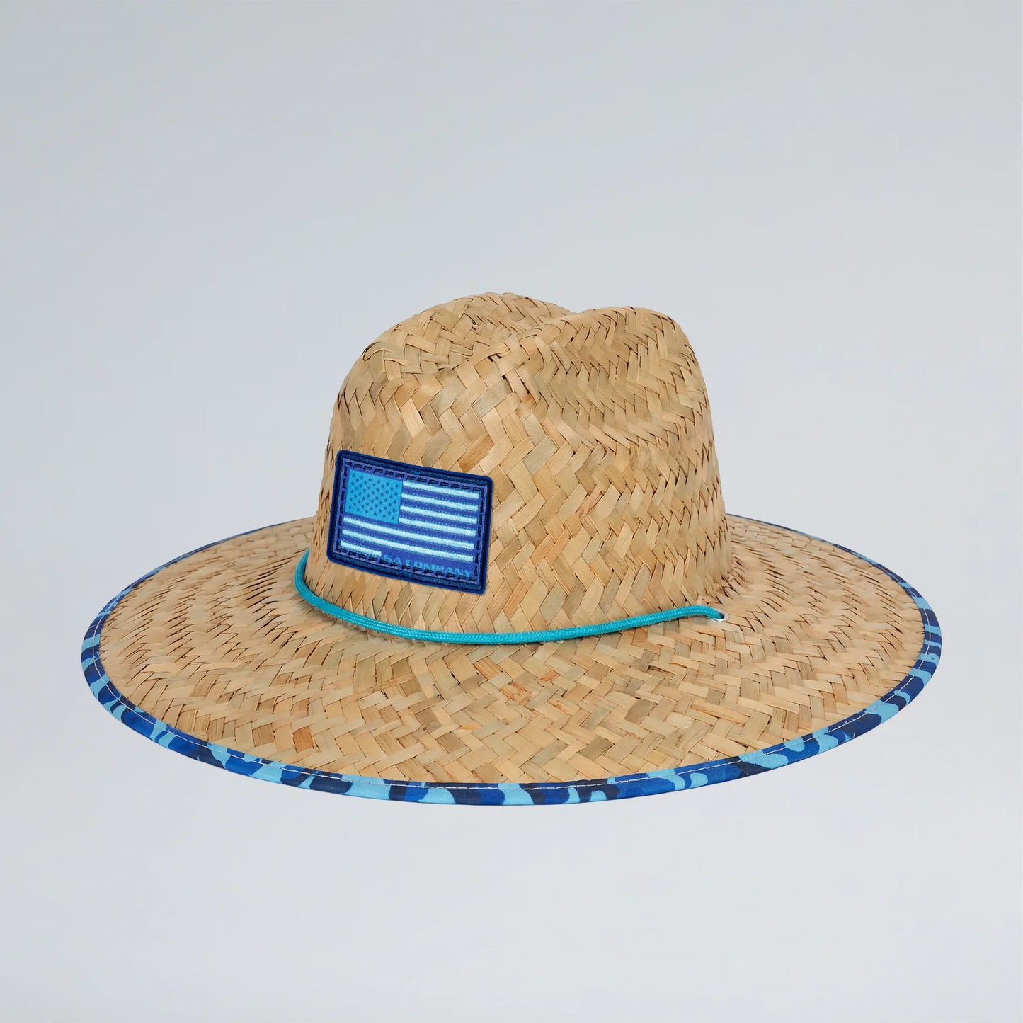 Straw hat with a blue band and American flag patch on a light gray background