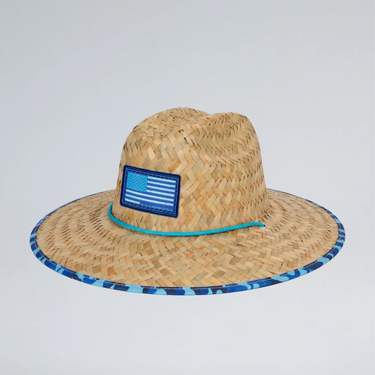 Straw hat with a blue band and American flag patch on a light gray background