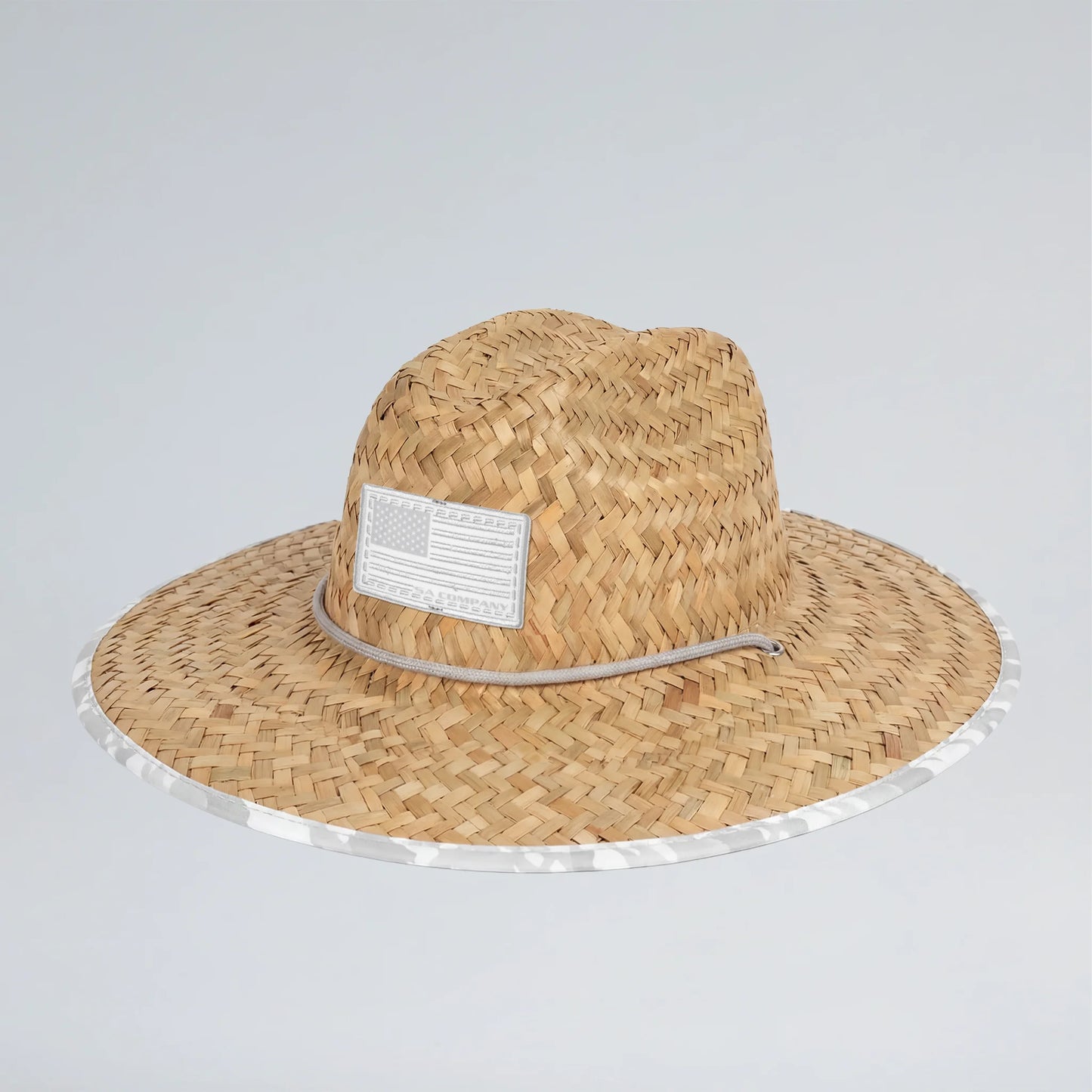 Straw hat with a label on a light gray background