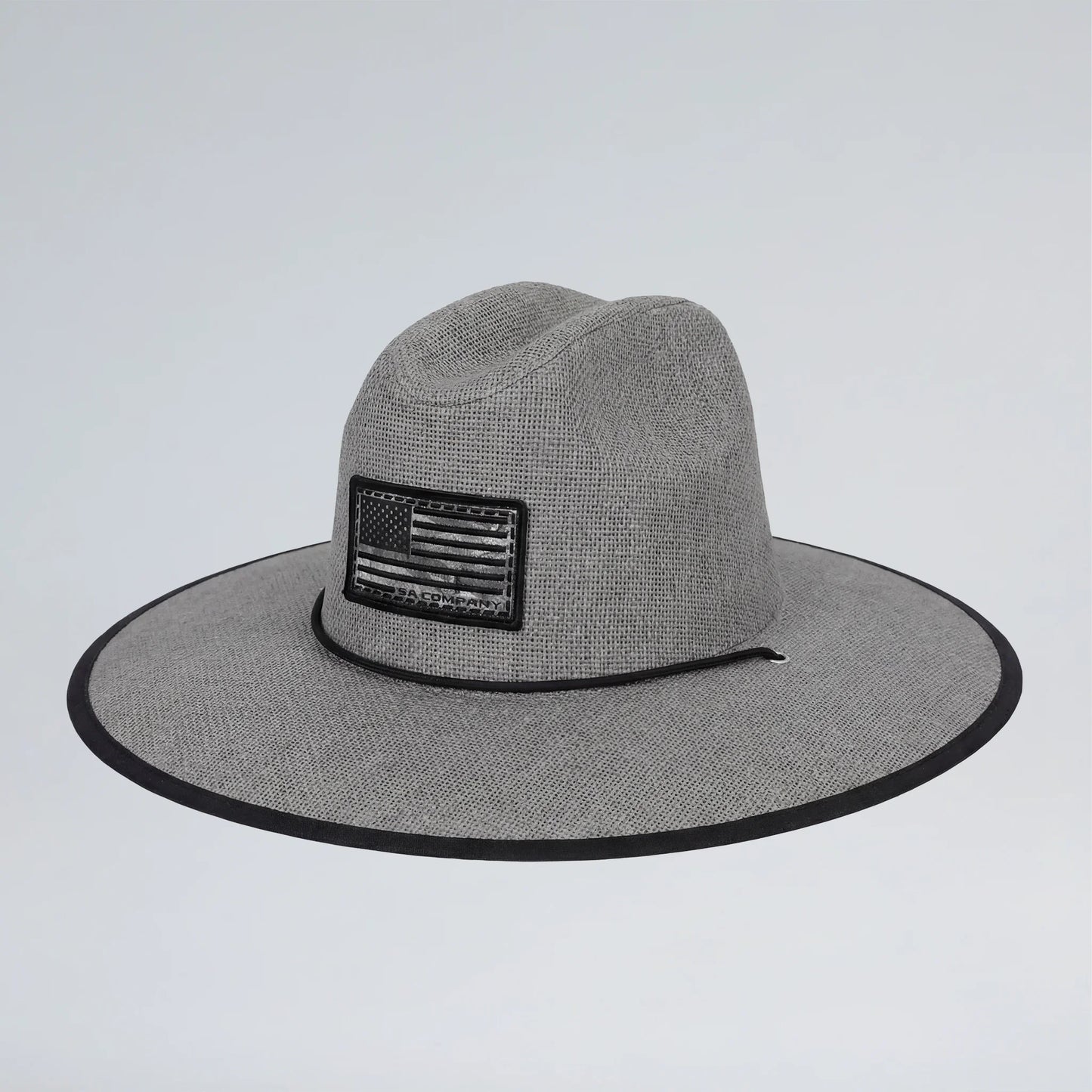Gray wide-brimmed hat with an American flag patch on a light gray background