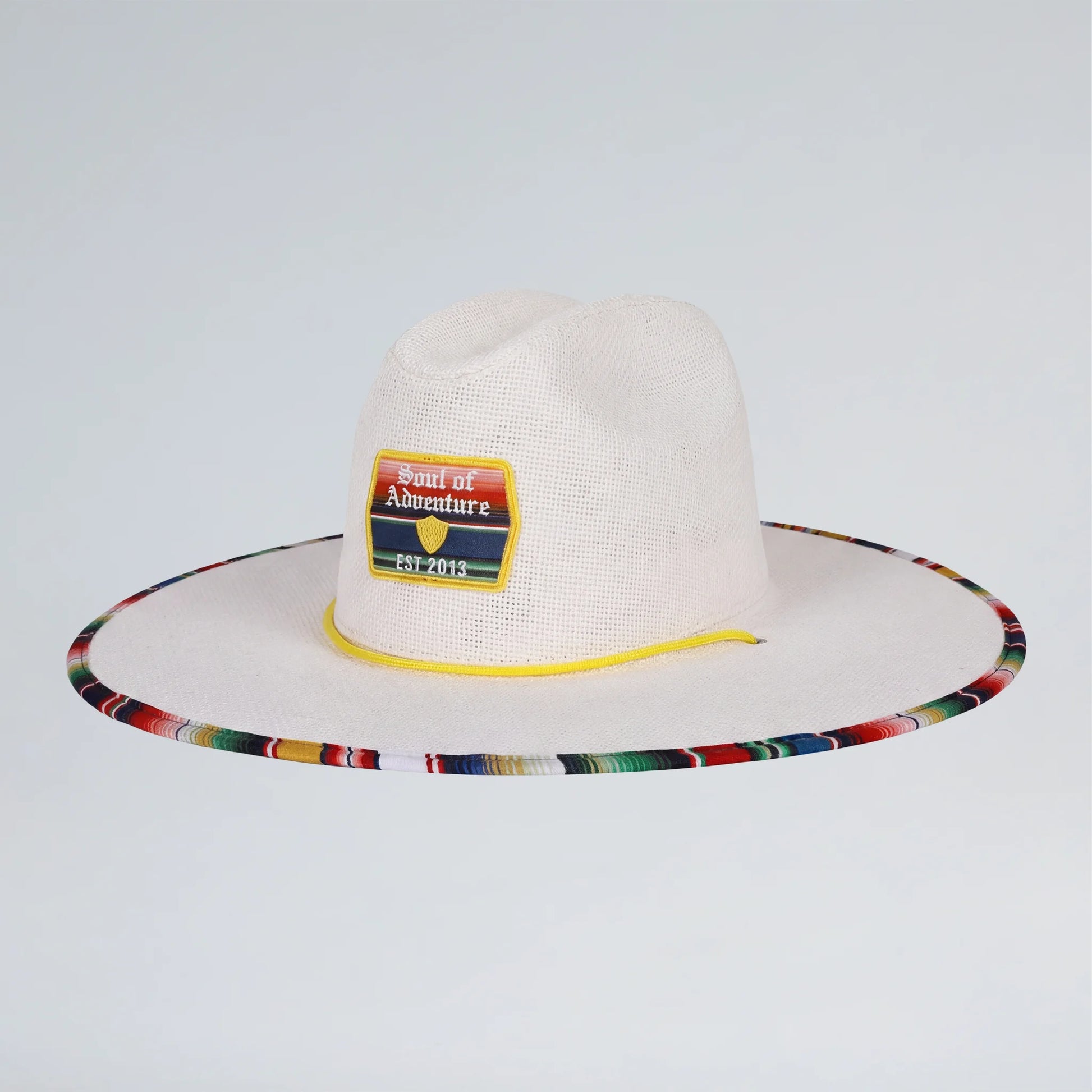 white straw hat with a colorful rim and yellow adjustable strap