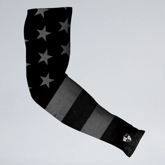 Black and gray arm sleeve with star pattern on a light gray background