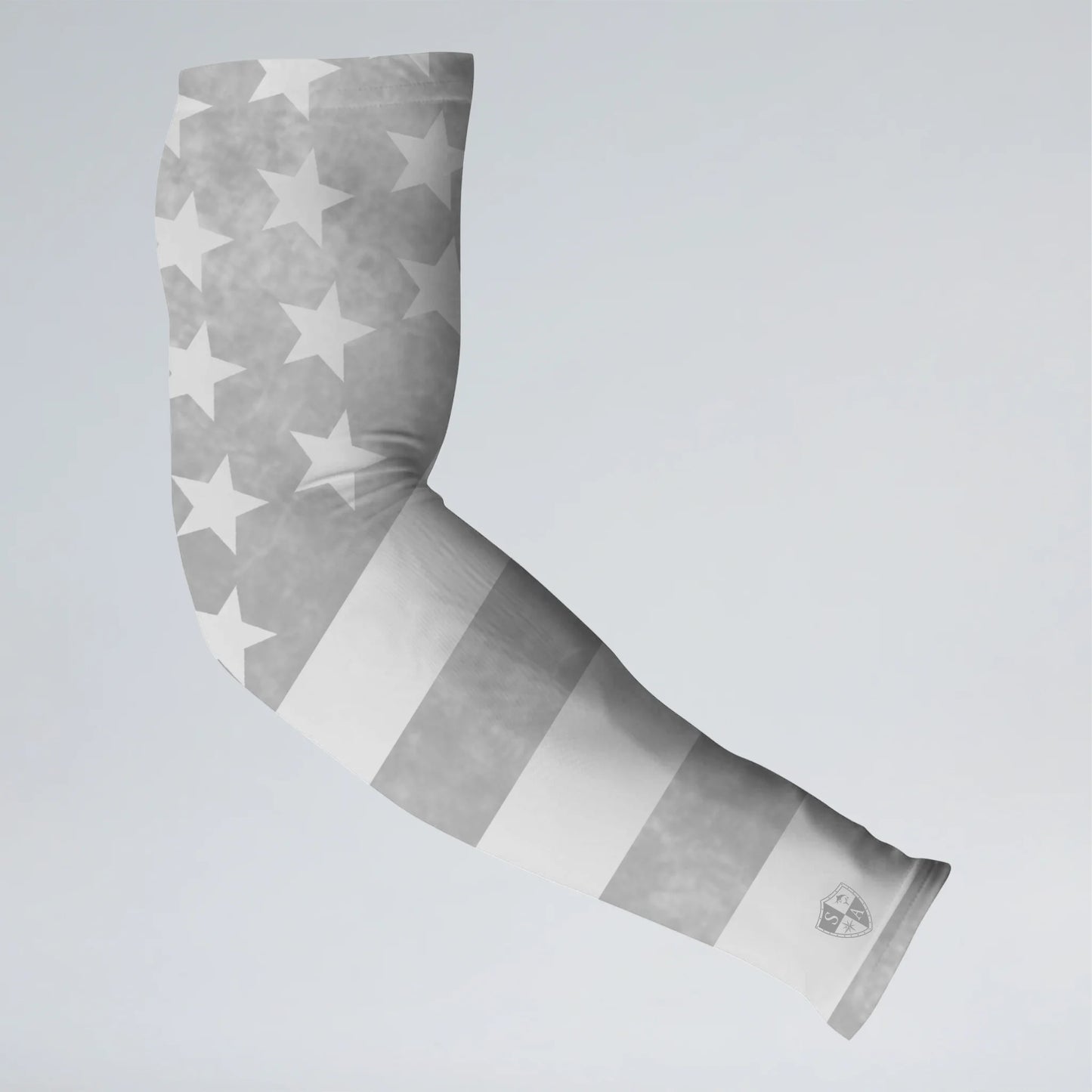 Gray and white patterned arm sleeve on a light gray background