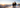 Couple in Pilot and Kalamata trapper hats snowshoeing a mountain ridge at sunset