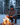 Man by a campfire in the snow wearing a fleece camper hat
